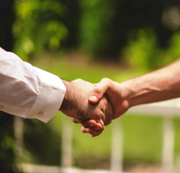 shaking hands working together